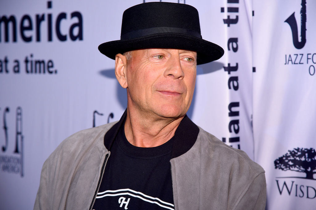 Bruce on the red carpet wearing a stingy-brim hat