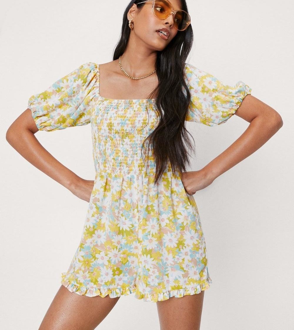 a floral romper with puff sleeves