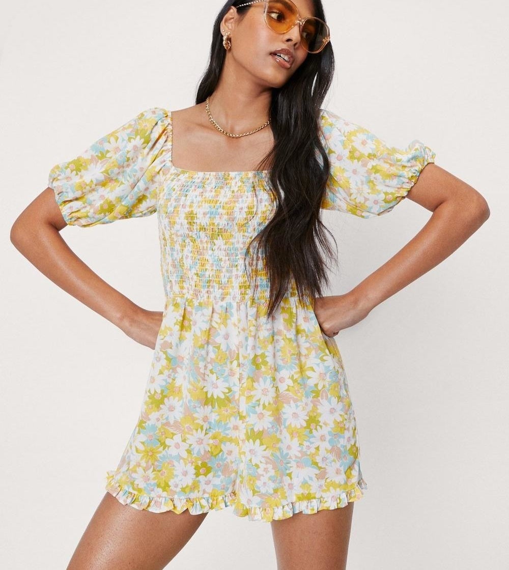 a floral romper with puff sleeves 