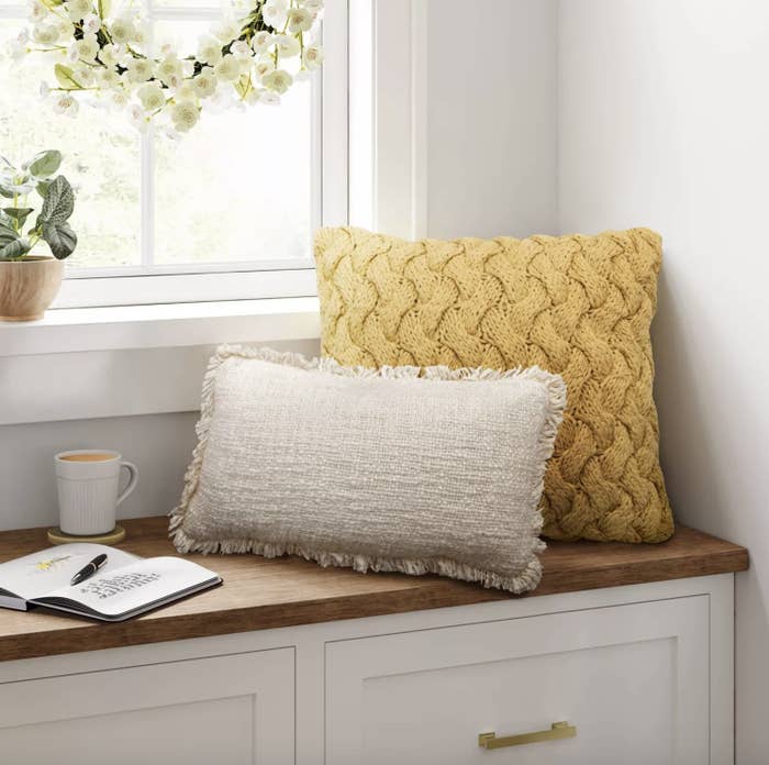 Chunky knit sweater on bay window bench