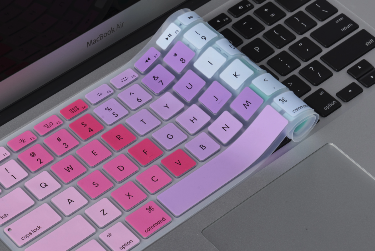 the silicone keyboard cover in a pink, purple, and blue ombre 