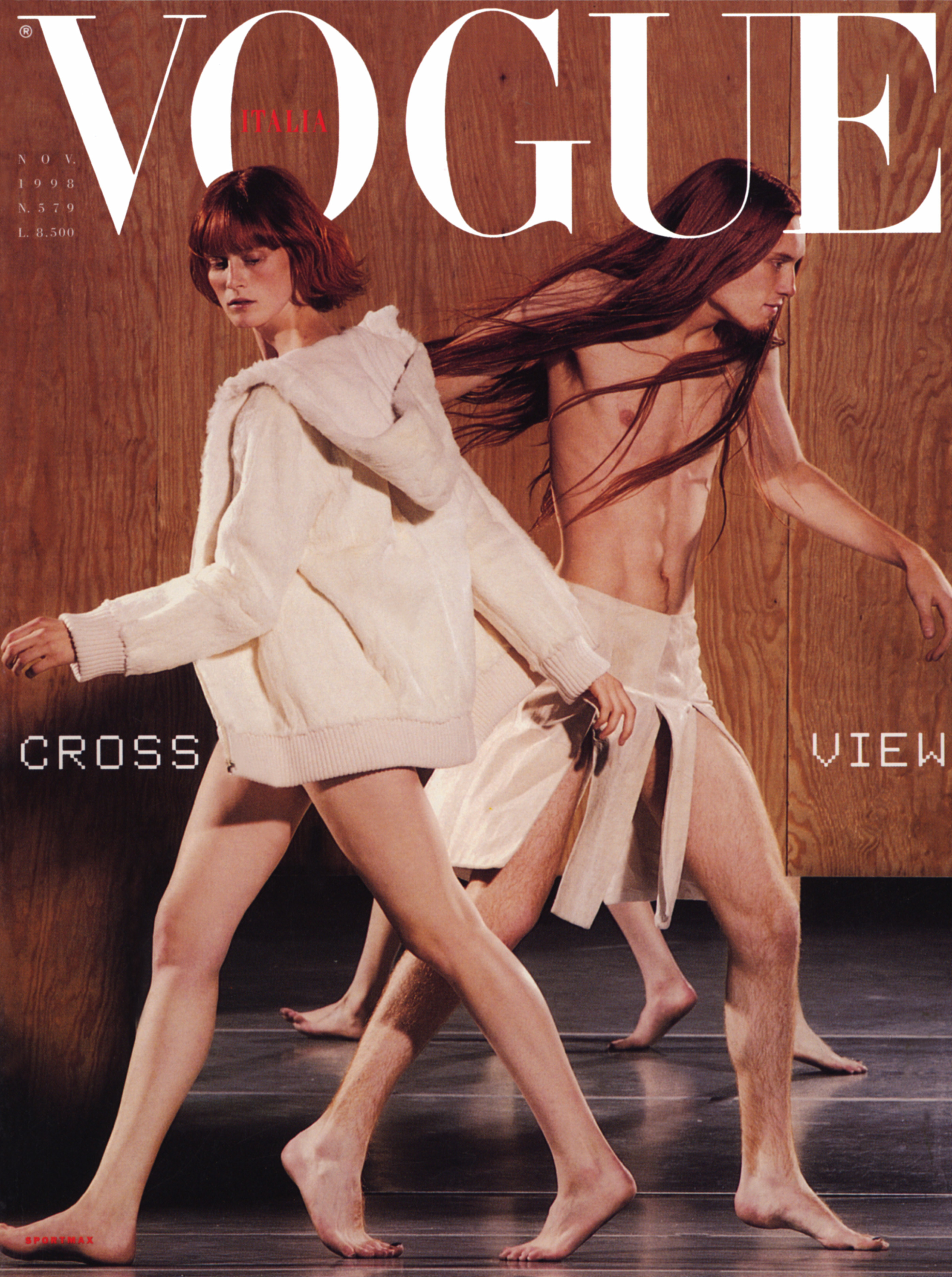 A Vogue cover with two people walking past each other