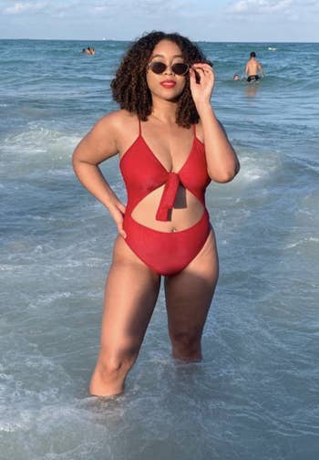 reviewer wearing the bathing suit in red 