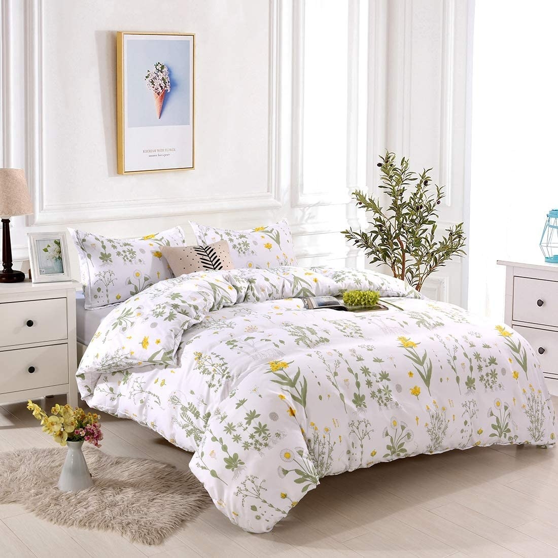 the yellow, green, and white floral bedding set with shams, a comforter, and sheets