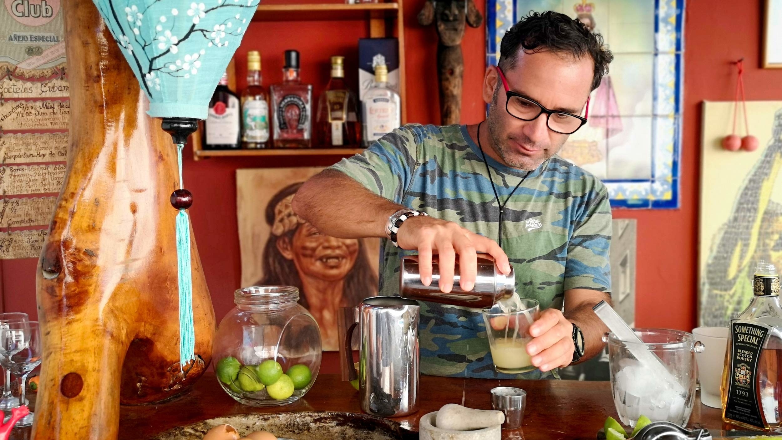 host making a Pisco sour