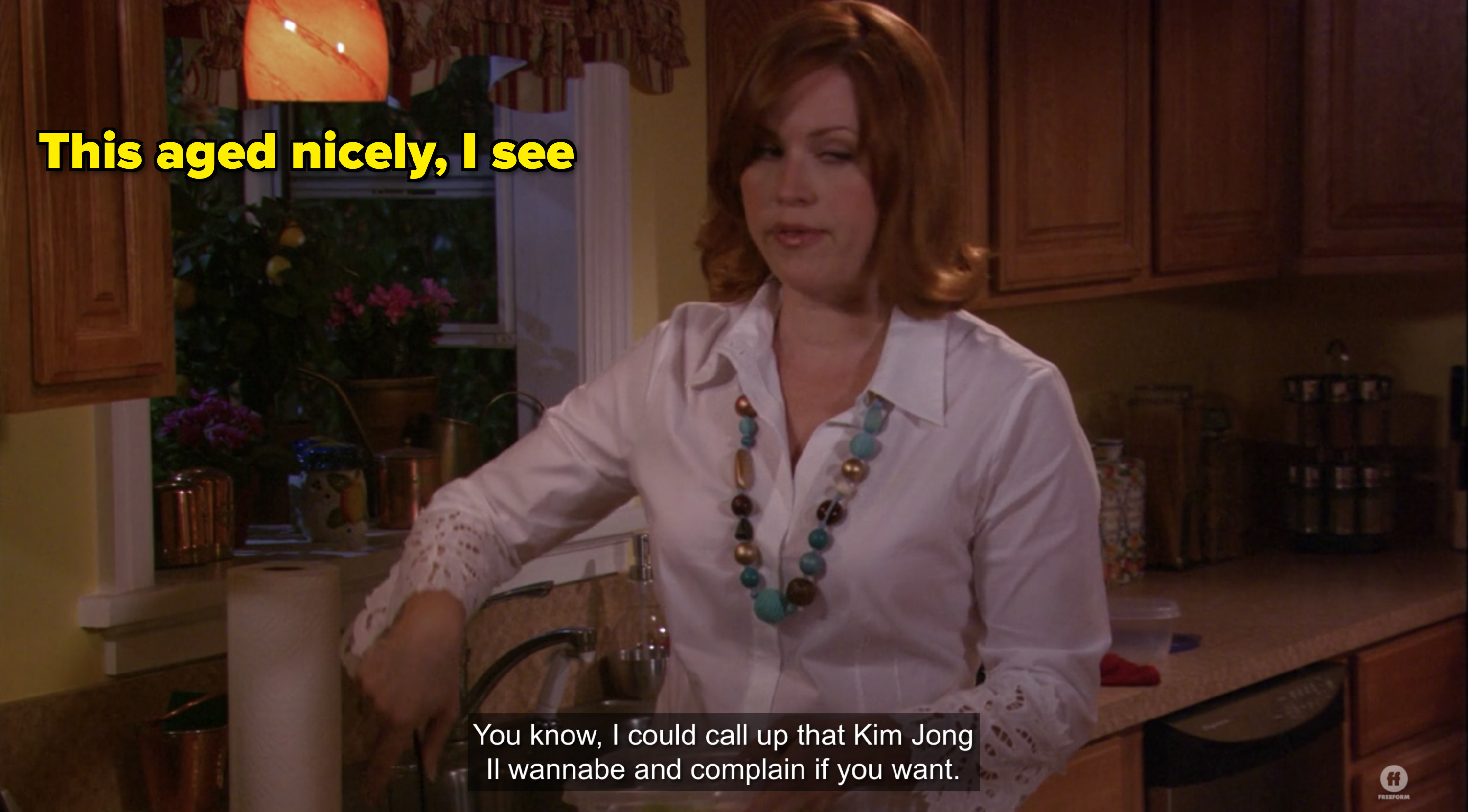 amy&#x27;s mom in kitchen making poor taste joke about kim jong II