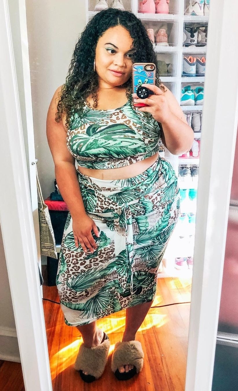 buzzfeed editor wearing the two-piece set in a green and brown jungle print 