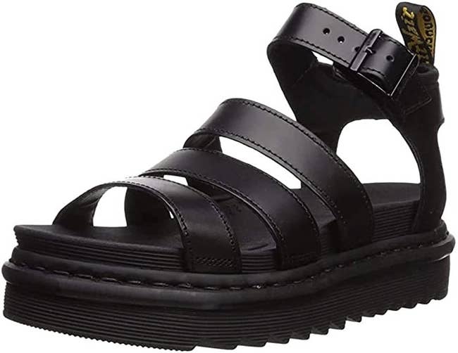 chunky black sandals with horizontal straps across the foot and an ankle strap 