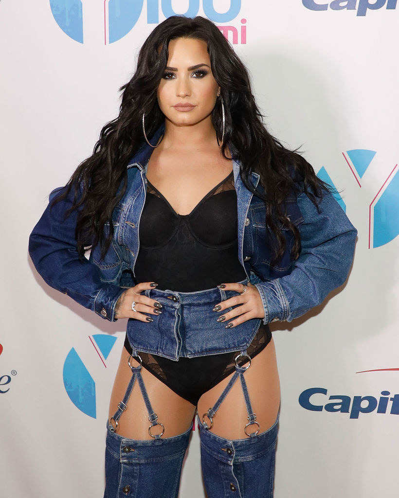 Demi Lovato attends the 2017 Y100 Jingle Ball in a denim outfit and matching denim boots