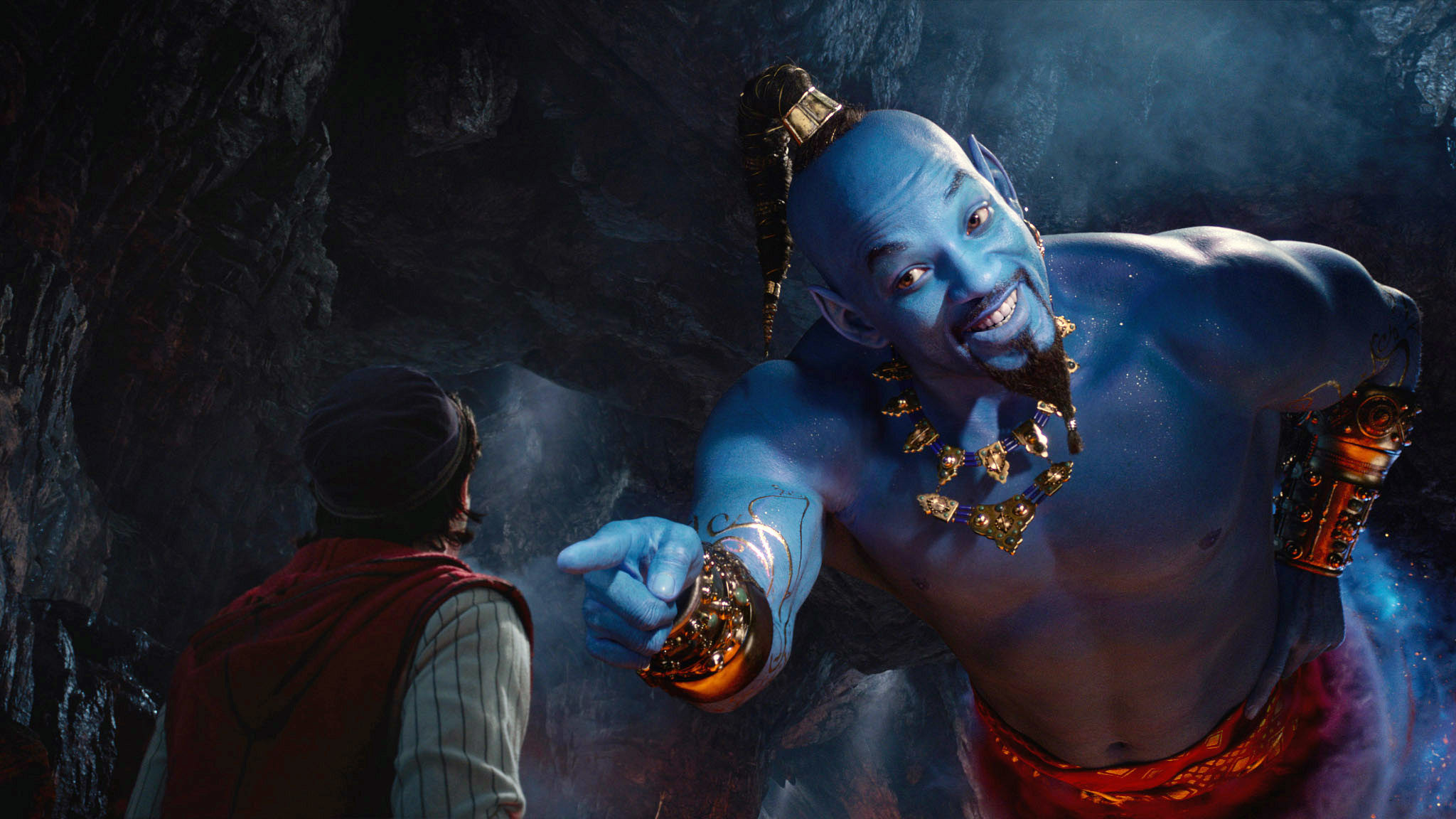 Photo of Will Smith as the Genie pointing at Aladdin