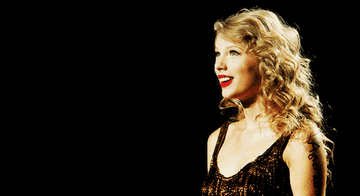 Taylor smiling at the crowd