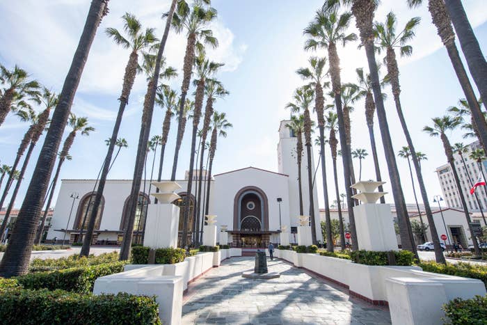 A photo of Union Station which is surrounded by palm trees