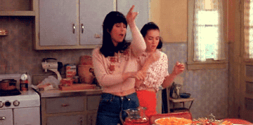 Cher and Winona Ryder dancing from a scene in Mermaids