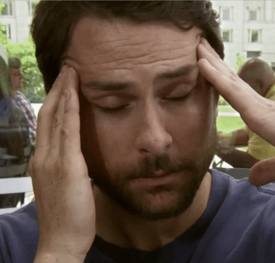 Charlie Day massaging his temples out of stress