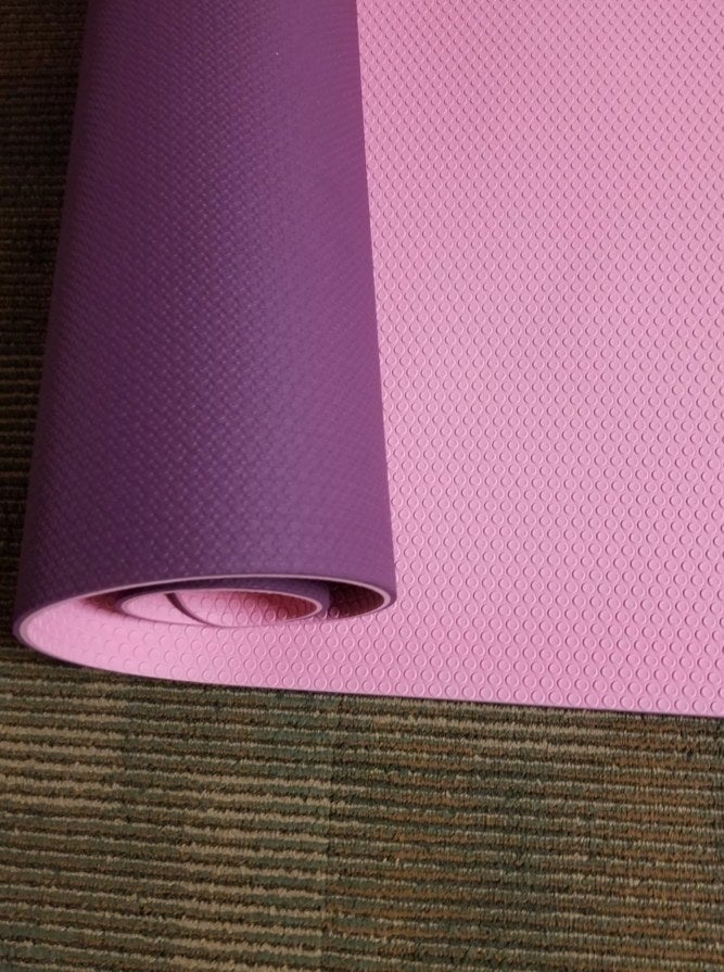 A purple/pink yoga mat in a reviewer&#x27;s home