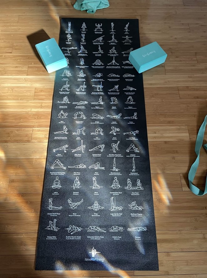 A yoga mat with poses on it in a reviewer&#x27;s home