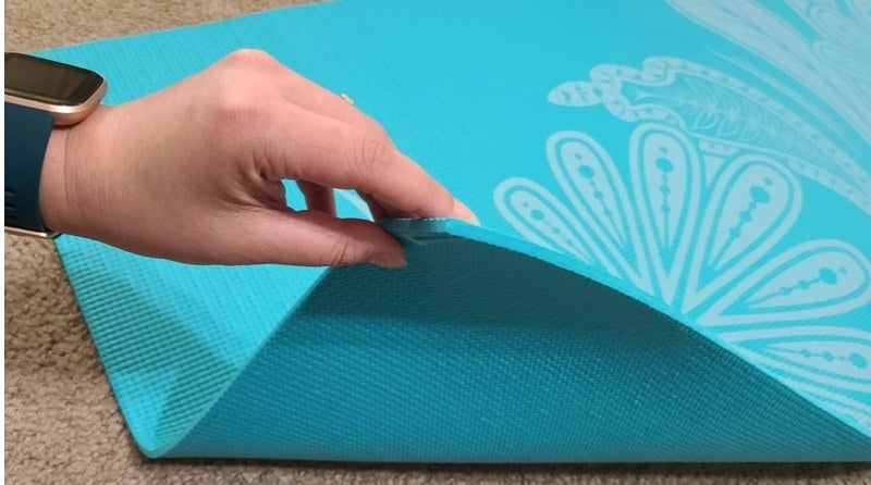A blue yoga mat in a reviewer&#x27;s home