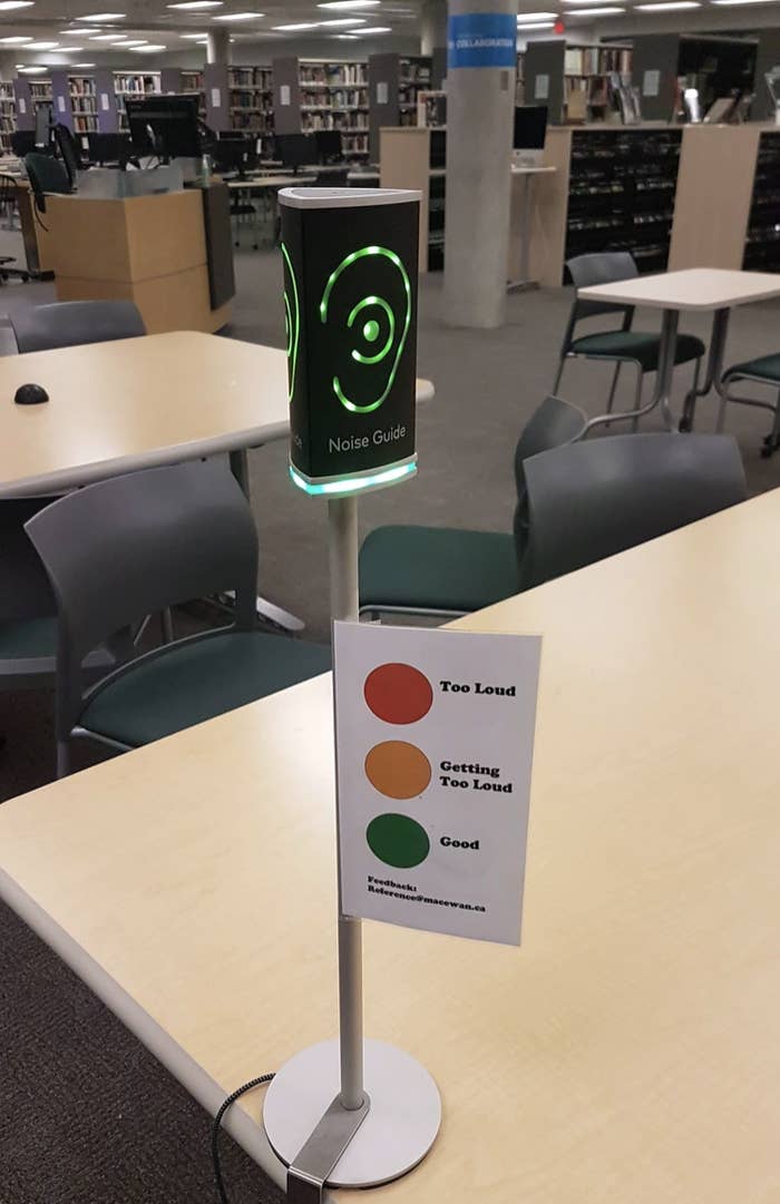 A device on the table of library that glows different colors based on the noise level