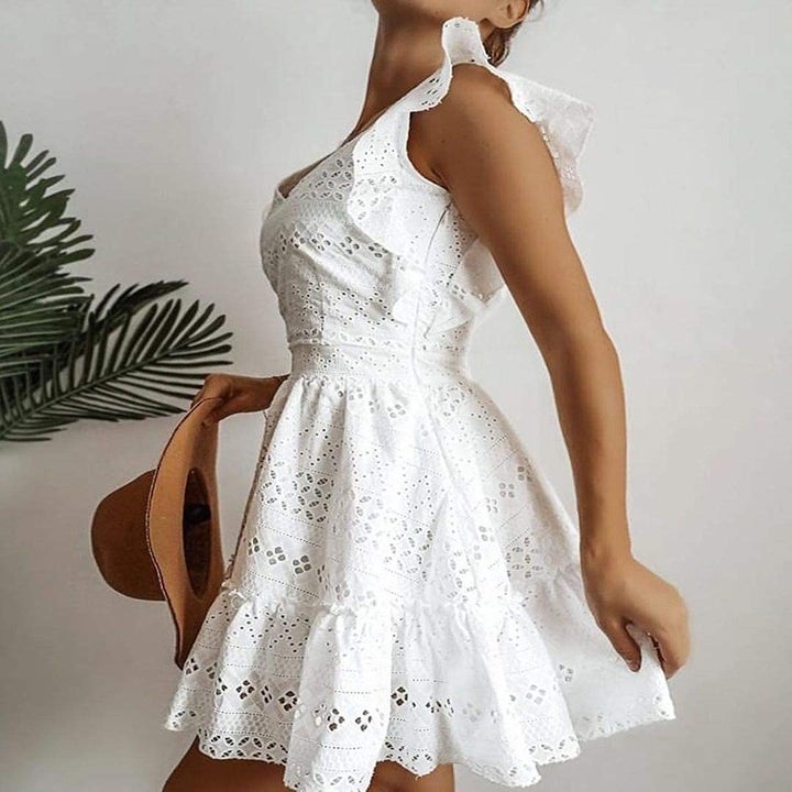 A model wearing the dress in white