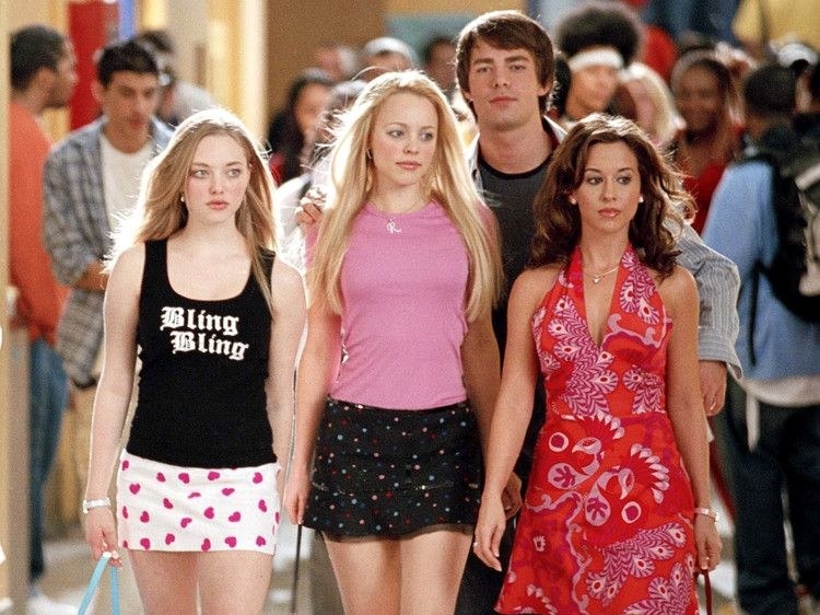 Regina, the other Plastics, and Aaron Samuels walking through the halls of high school and looking cool