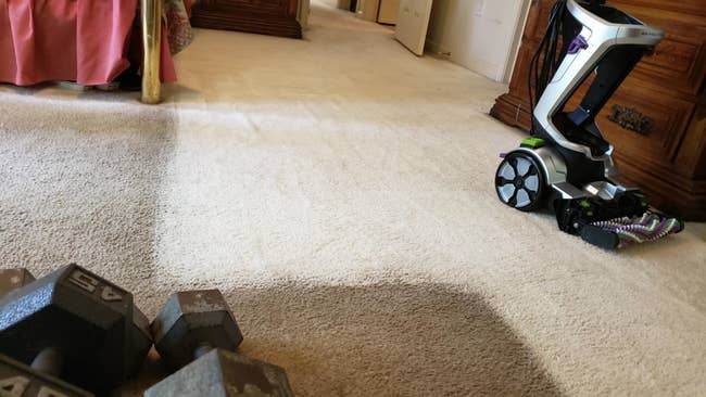 reviewer image of dirty and dark carpet next to clean and light carpet with the bissel pet pro on top
