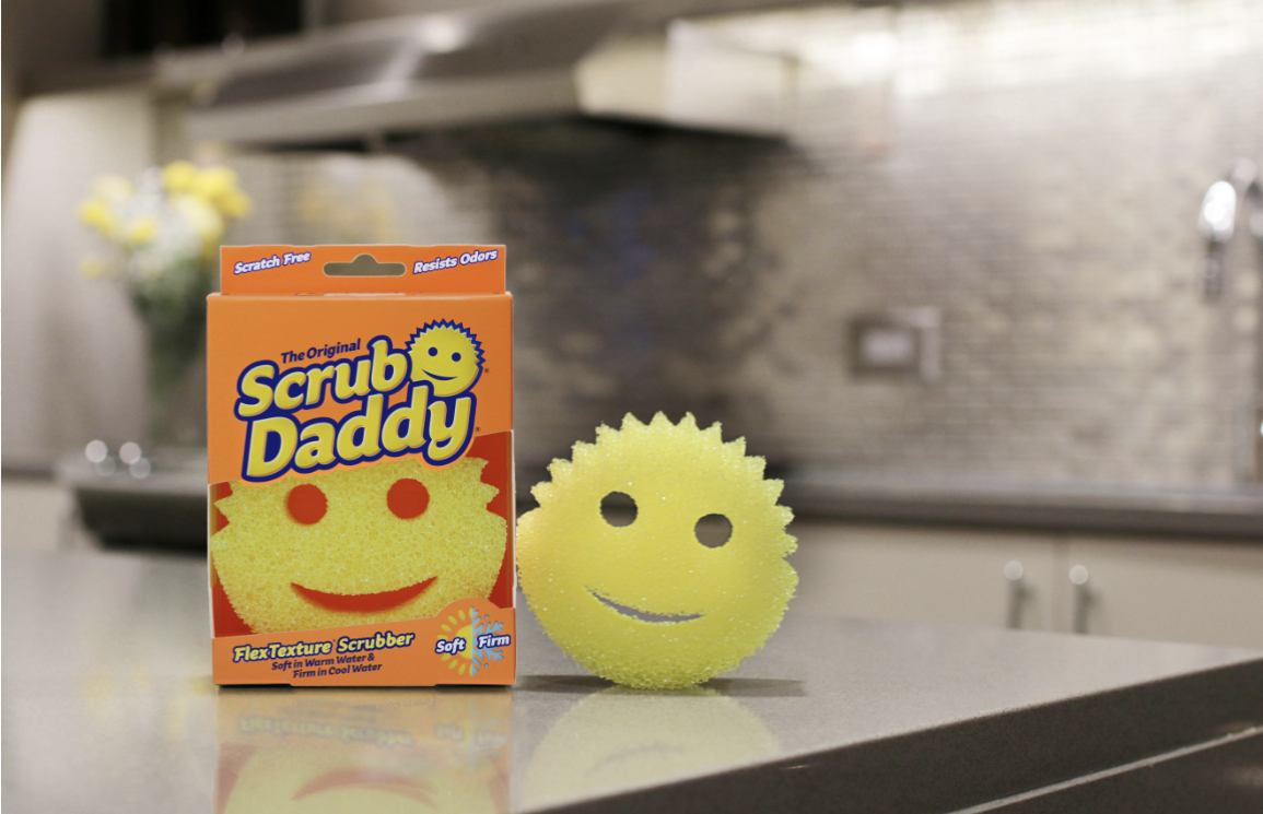 Yellow Scrub Daddy placed on kitchen counter