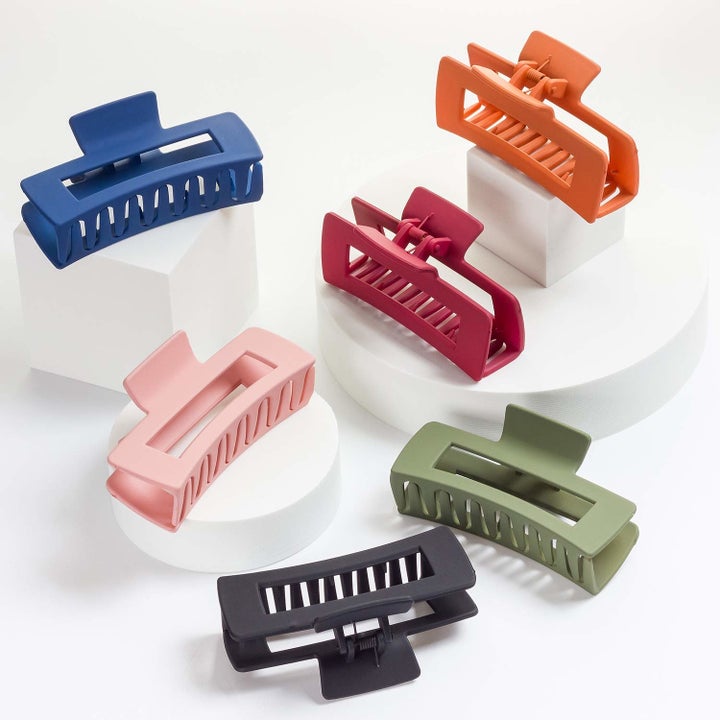 a blue, pink, black, red, orange, and green claw clip