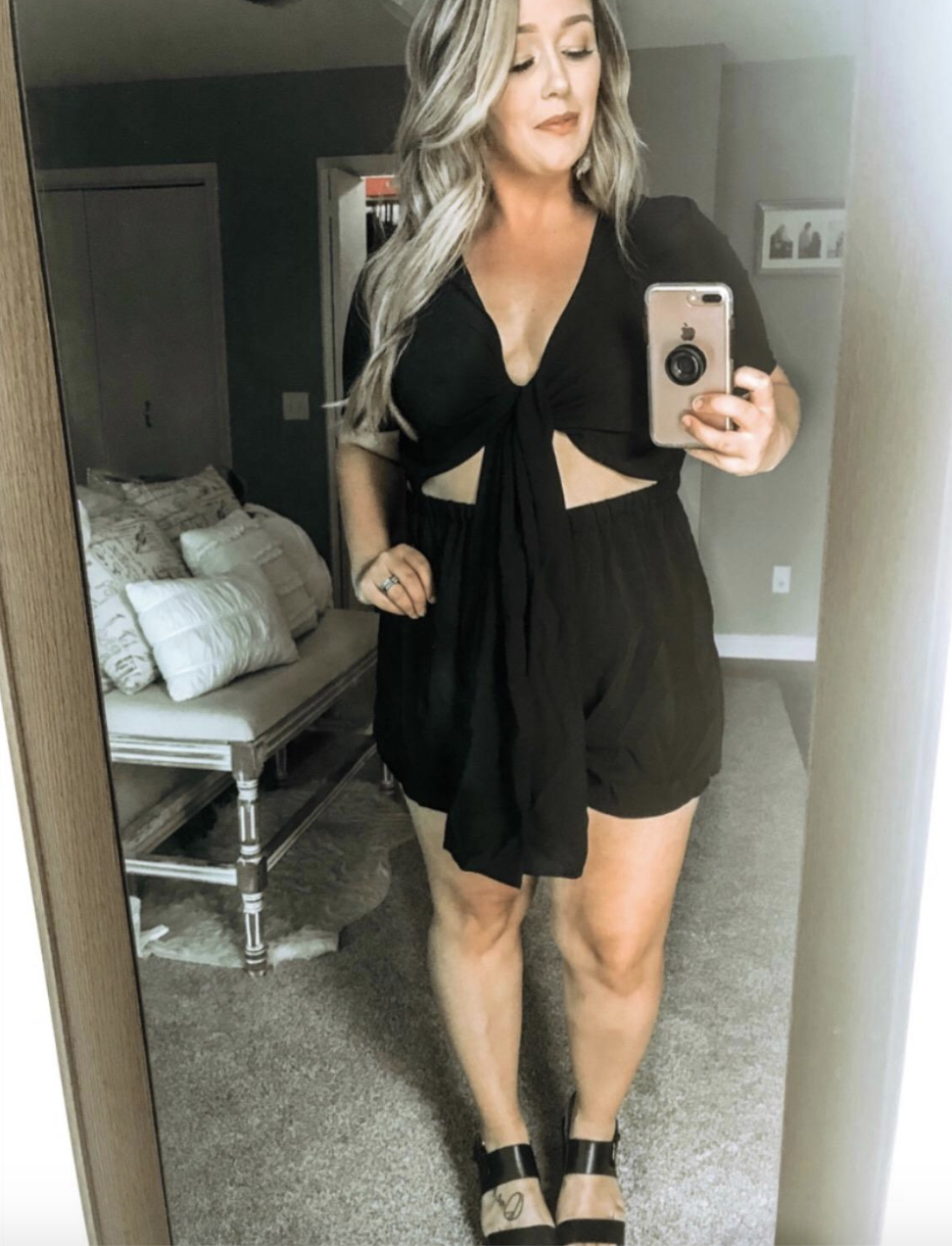 reviewer wearing the black cutout romper