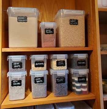 reviewer image of the full 15 piece Vtopmart Airtight Food Storage Containers Set in a cabinet being used to store different kinds of food