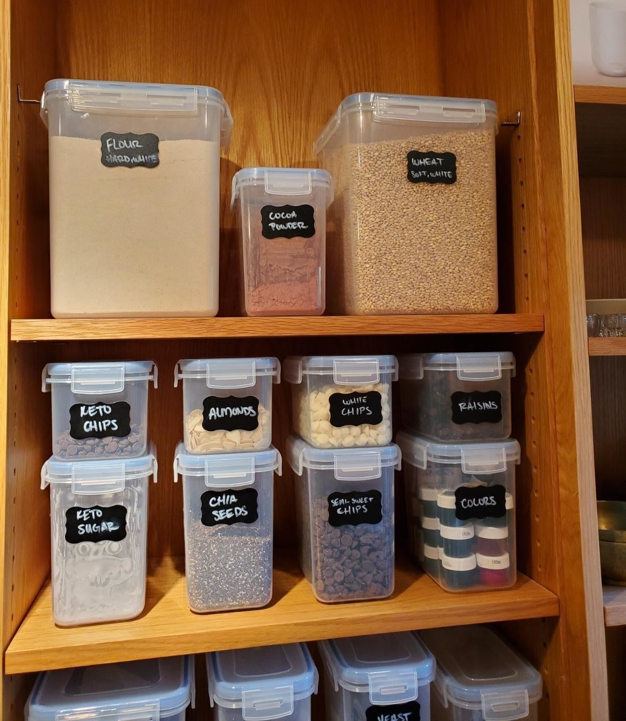 reviewer image of the full 15 piece Airtight Food Storage Containers Set in a cabinet being used to store different kinds of food