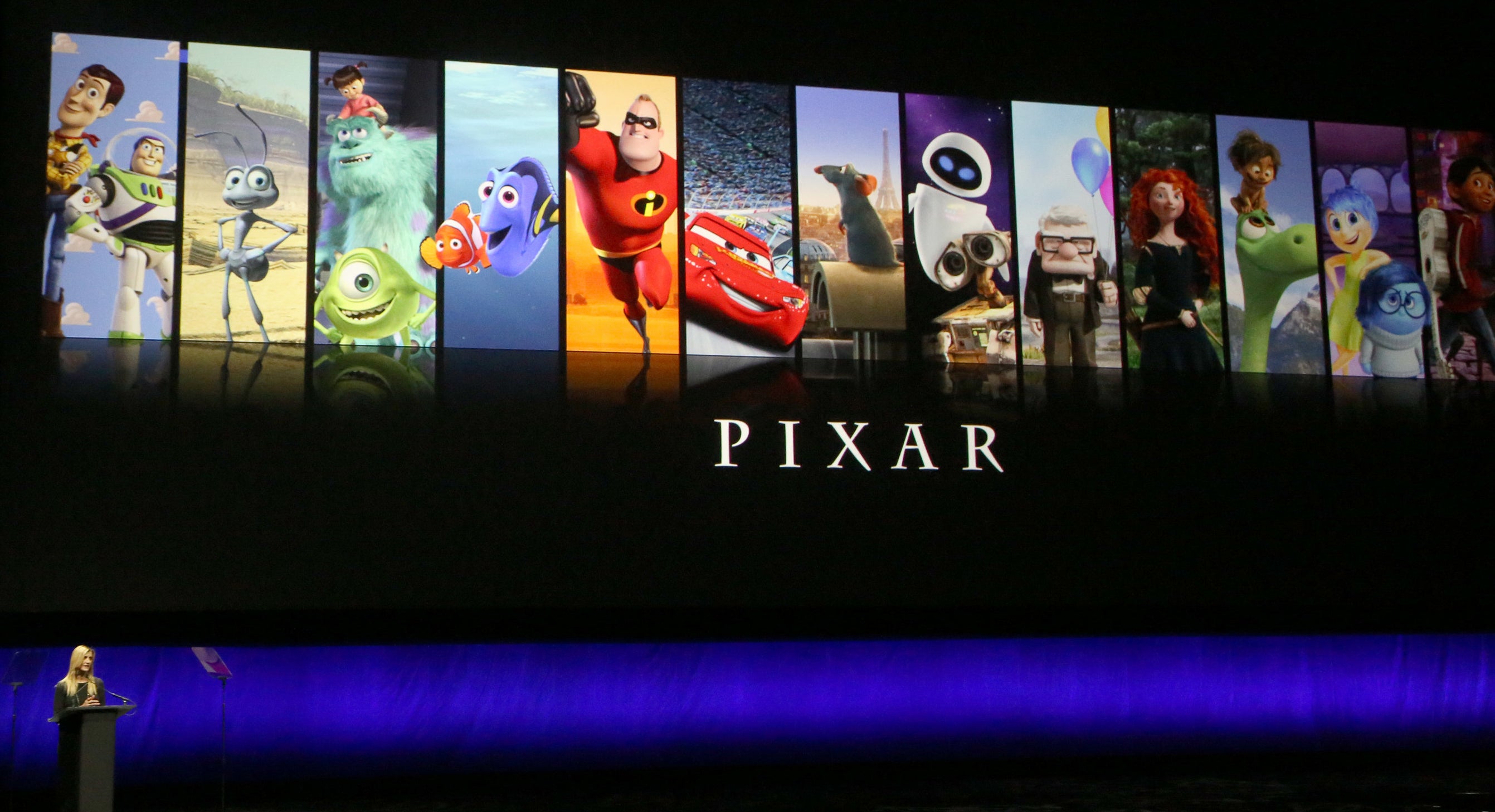 A presentation showing the title &#x27;Pixar&#x27; with vertical banners of different Pixar movies, including Toy Story, Monsters Inc, and the Incredibles