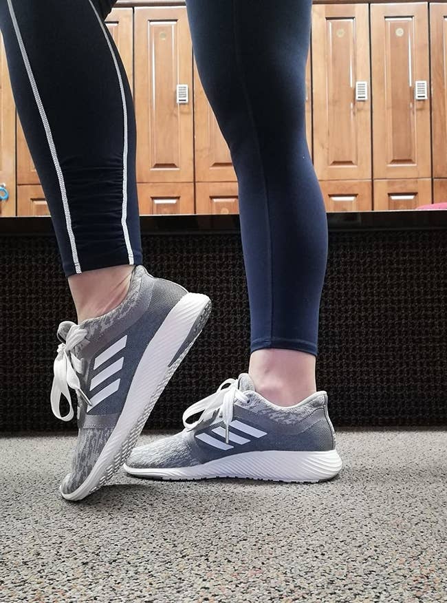 Reviewer wearing Adidas Edge Lux Clima running shoes