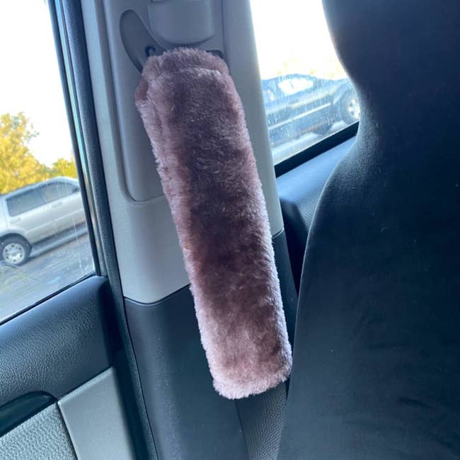 the fuzzy cover on a seatbelt