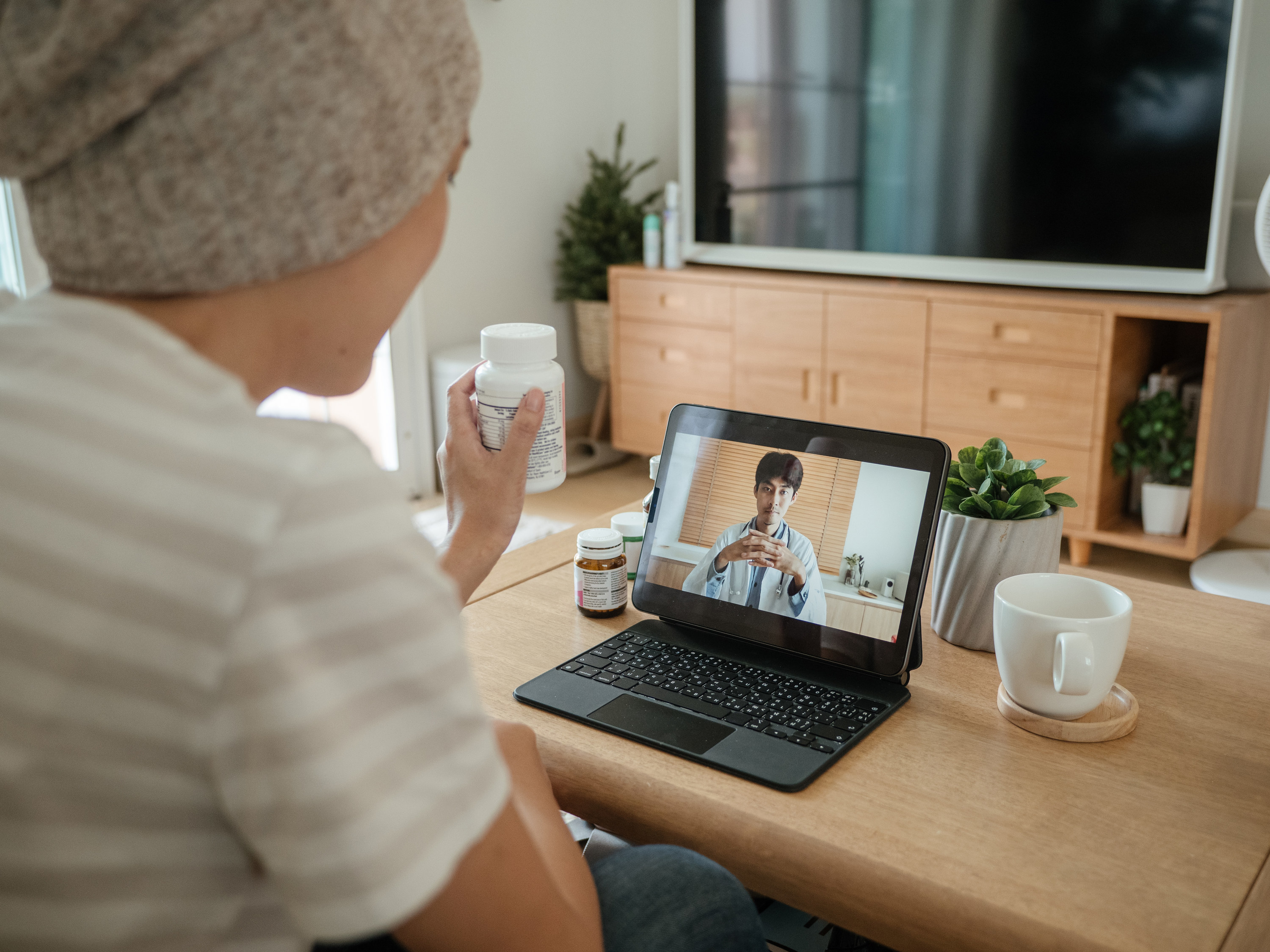 Woman on a video call with her doctor