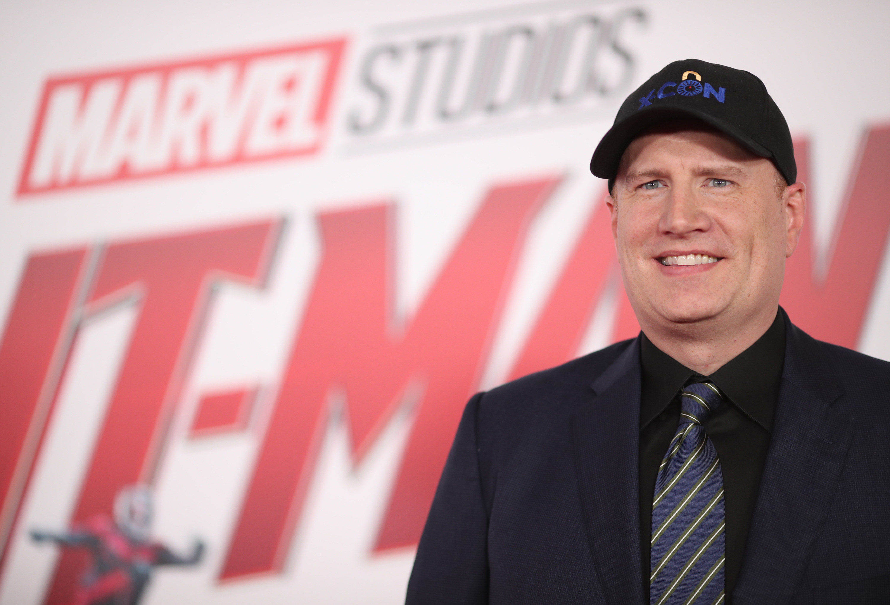 Kevin smiles at a Marvel event