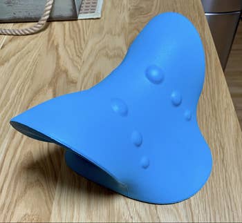 Blue version of the pillow on desk