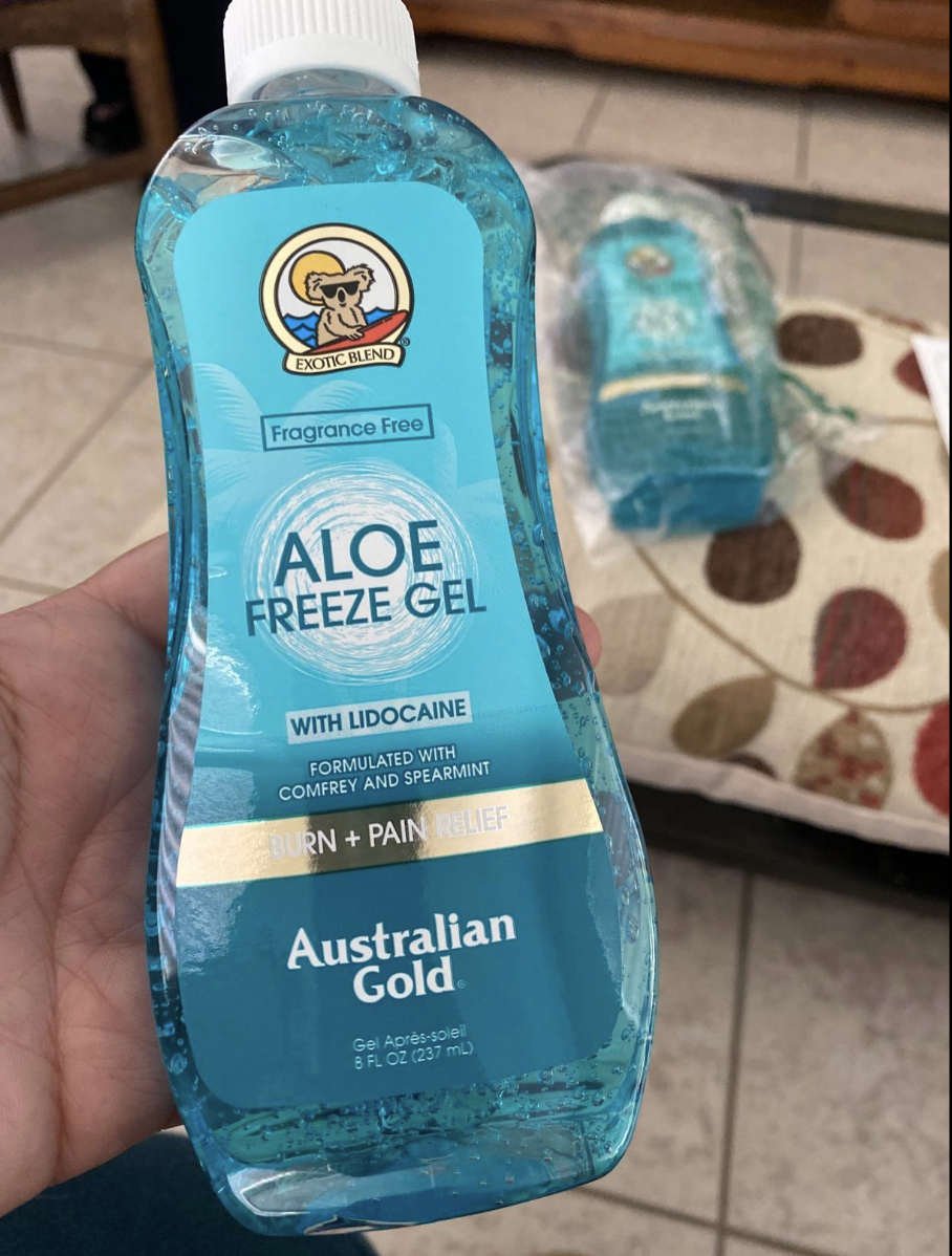 Reviewer holding bottle of blue freeze gel 