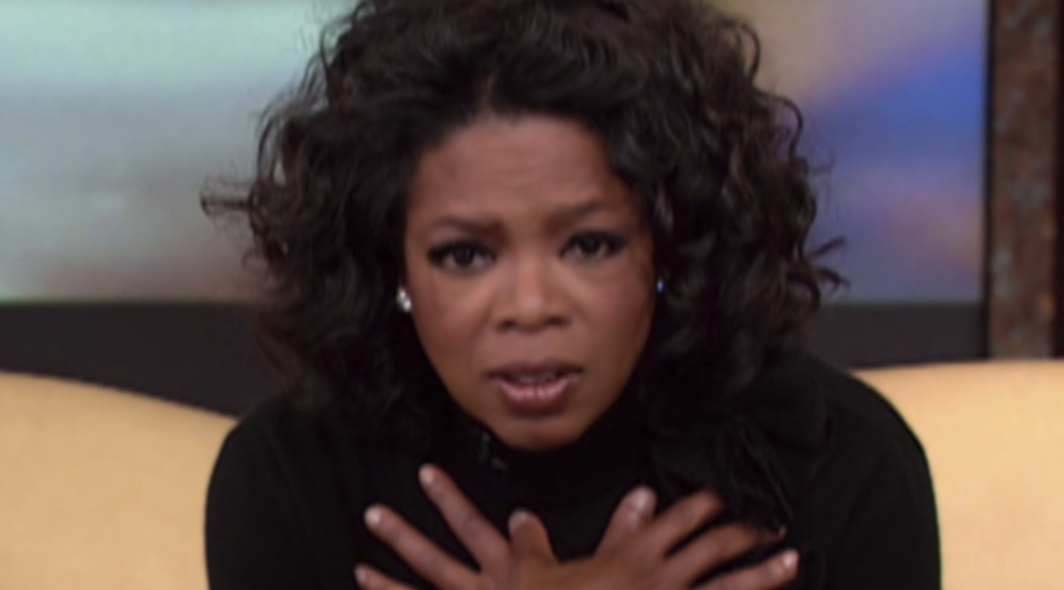 Oprah looking concerned but intrigued 