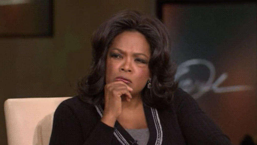 Oprah looking intently 