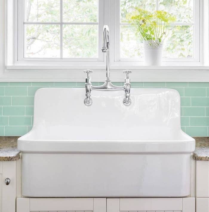the metro lucas Smart Tiles 3D Peel and Stick Backsplash on a kitchen wall