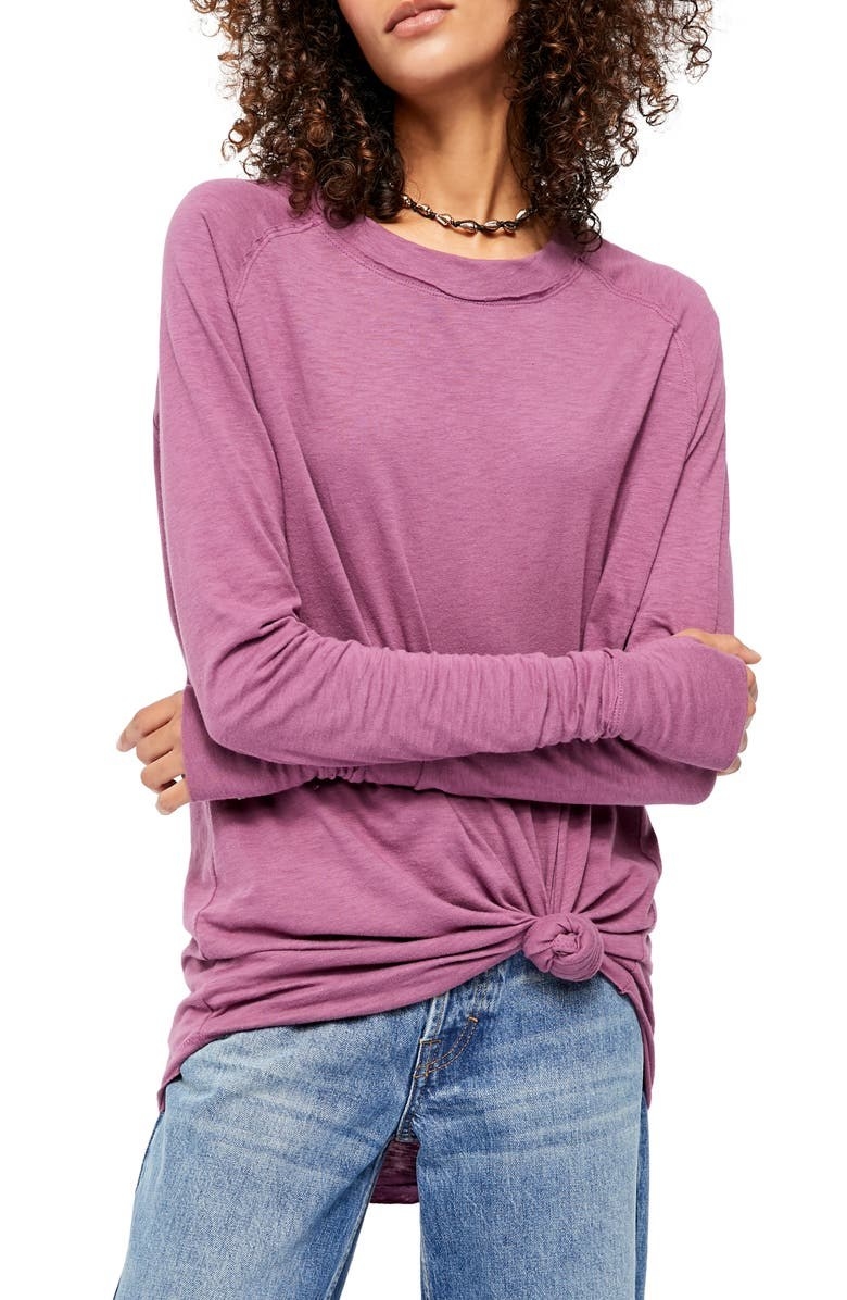 A model wears the top in Plum knotted over jeans