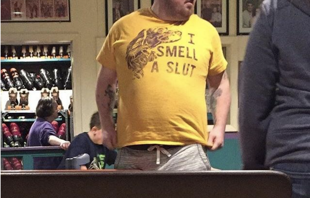 A man&#x27;s shirt reads I smell a slut