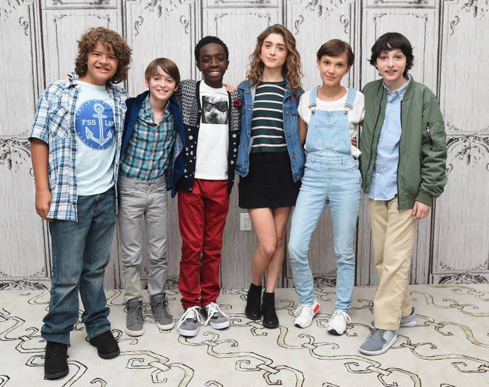 The young cast posing for a photo together