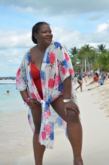 Reviewer wearing cardigan as beach cover up