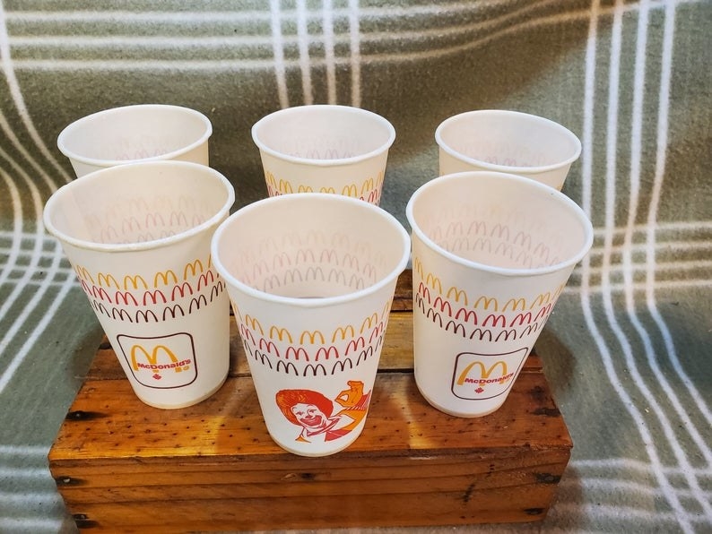 A group of six white McDonald&#x27;s kids cups
