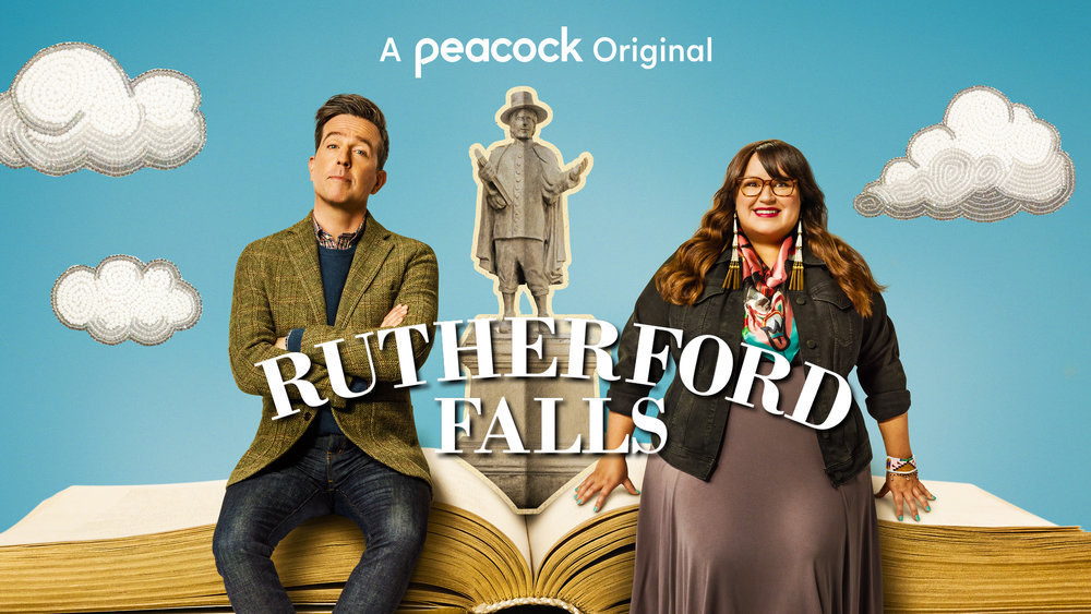 Promotional graphic for Rutherford Falls featuring two characters sitting on an open books with clouds in the background