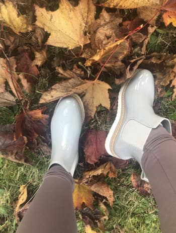 reviewer pic of looking down at shoes while in a pile of leaves