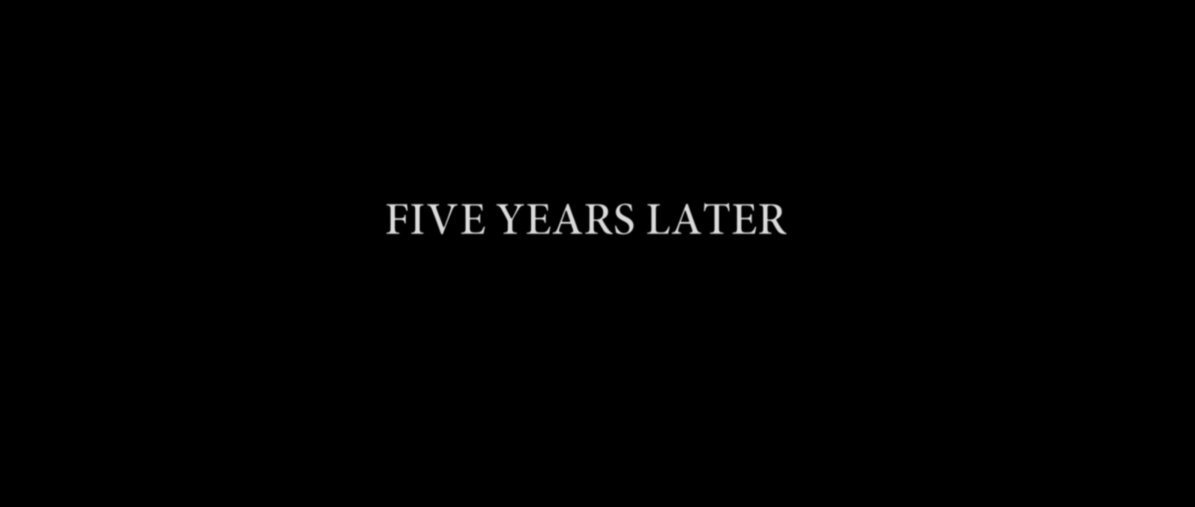 Black screen with the words &quot;five years later&quot; 