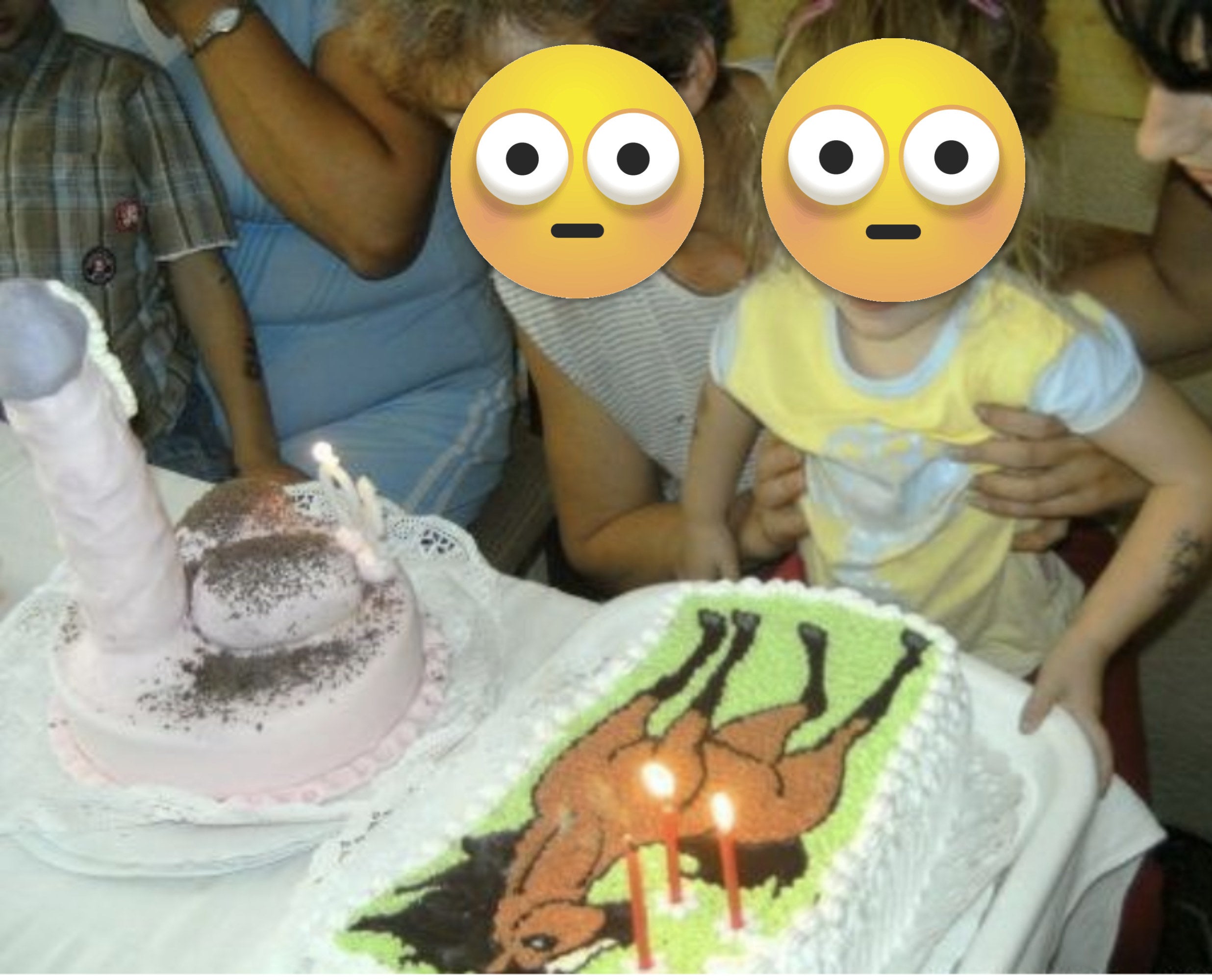 A very large erection cake next to a cake with a horse drawn on it, as someone holds up a little girl to blow out the candles on the horse cake