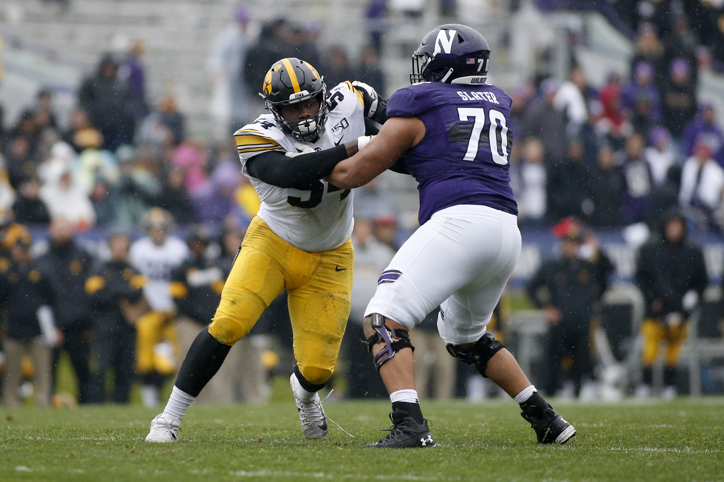 Rashawn Slater blocking an Iowa player